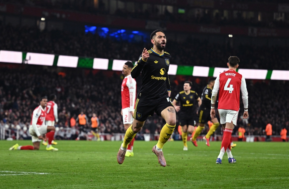   Manchester United's Matheus Cunha celebrates scoring their third goal  
