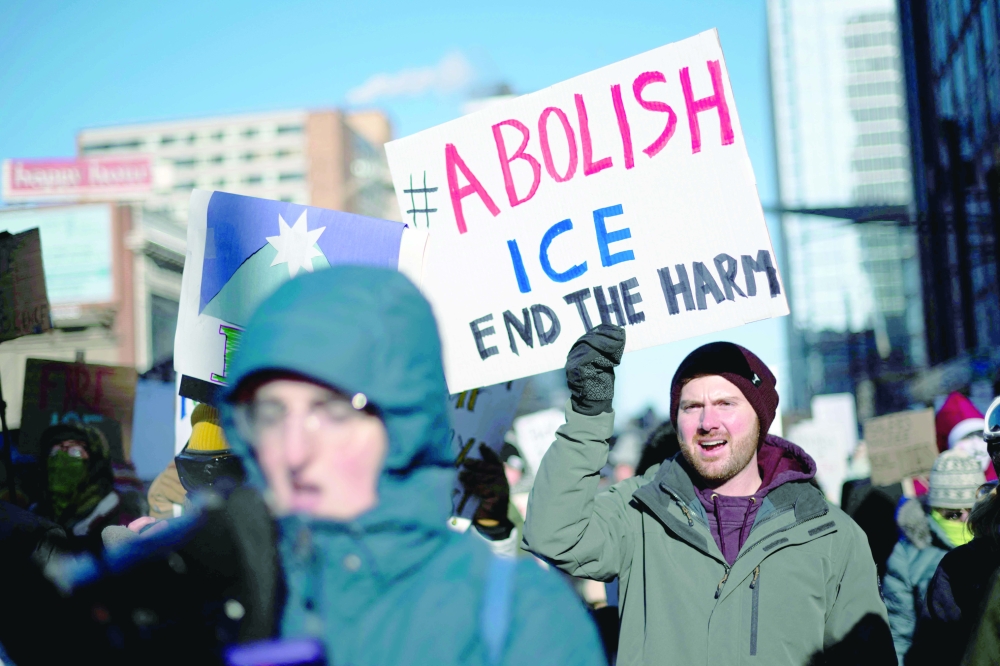 Protesters against Immigration and Customs Enforcement (ICE) march through the streets, Minneapolis. — AFP