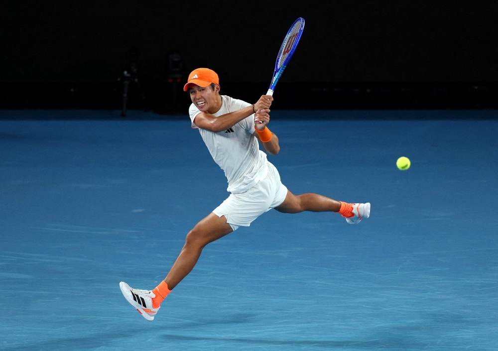  Learner Tien of the U.S. in action during his quarter final match against Germany's Alexander Zverev 