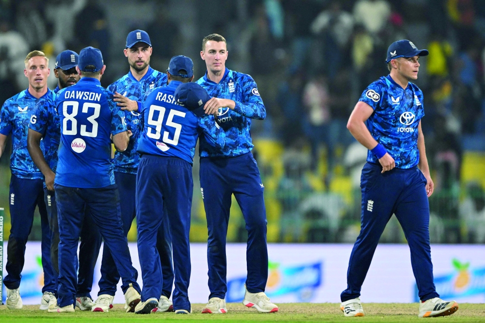 England's captain Harry Brook (2R) celebrates with teammates after winning in the third one-day international (ODI) cricket match against Sri Lanka at the R. Premadasa International Cricket Stadium in Colombo on January 27, 2026. (Photo by Ishara S. KODIKARA / AFP)
