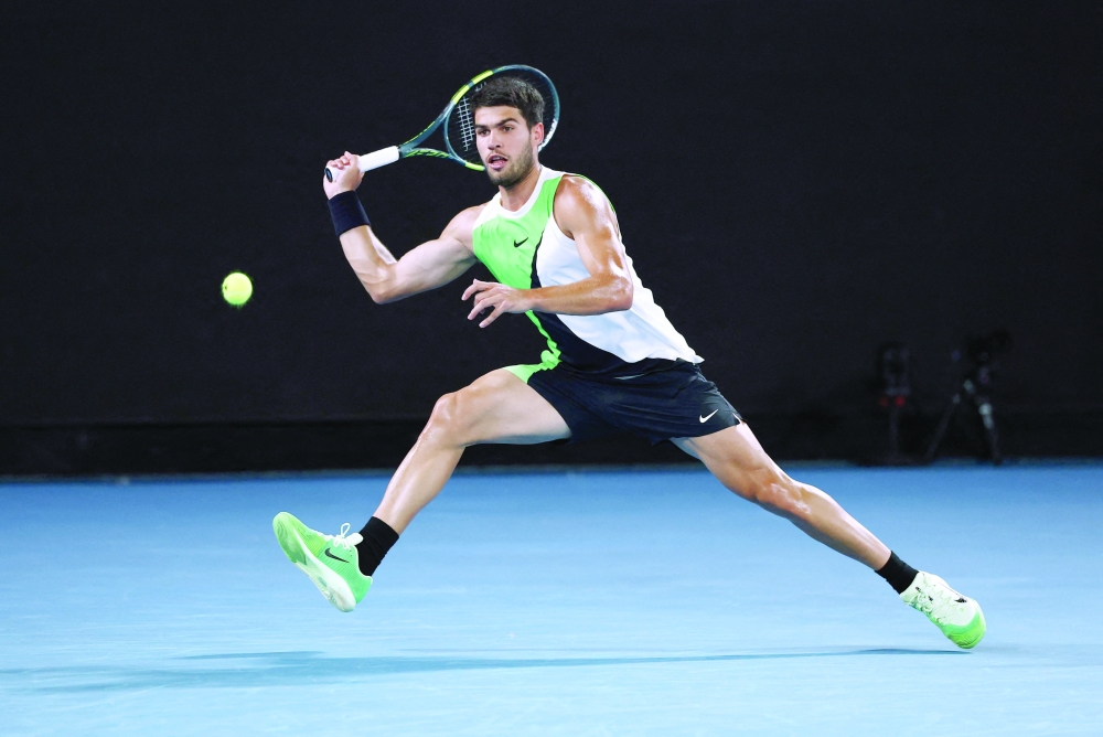Spain's Carlos Alcaraz in action during his Australian Open quarterfinal match against Australia's Alex De Minaur at Melbourne Park. — Reuters