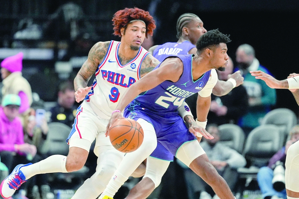 Charlotte Hornets' Brandon Miller (24) handles the ball defended by Philadelphia 76ers' Kelly Oubre Jr (9) at Spectrum Center. — Imagn Images