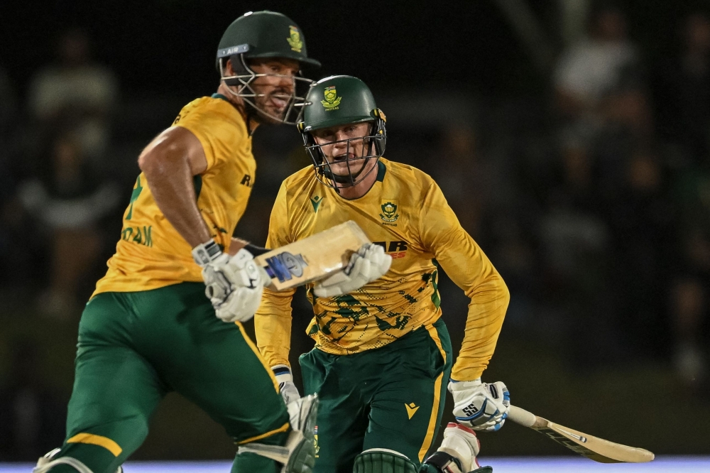 South Africa's Ryan Rickelton (R) and South Africa's Aiden Markram (L) run between the wickets  