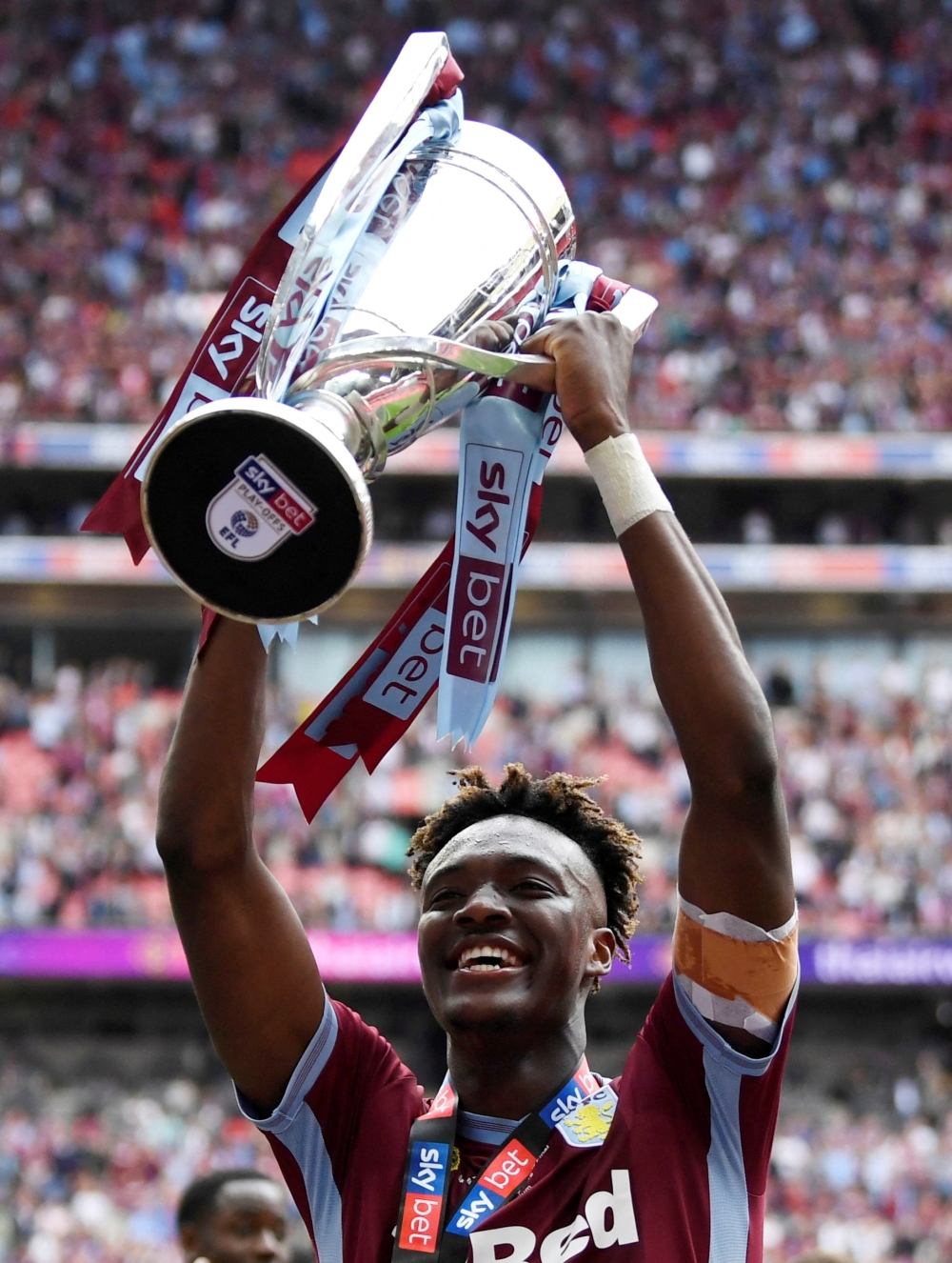   Aston Villa's Tammy Abraham celebrates with the trophy after winning the playoffs 