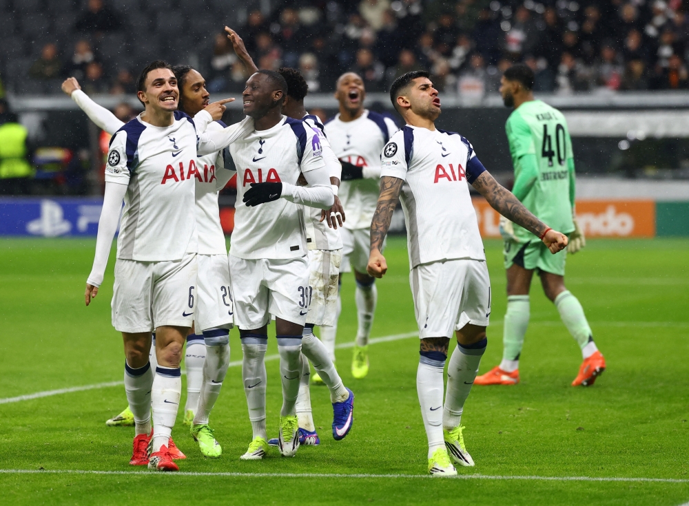  Randal Kolo Muani celebrates scoring their first goal with Joao Palhinha, Cristian Romero and Djed Spence 