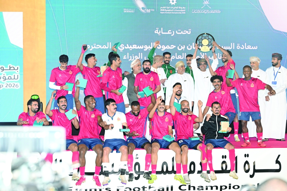Royal Court Affairs players celebrate with the trophy. — Abdulwahid al Hamadani