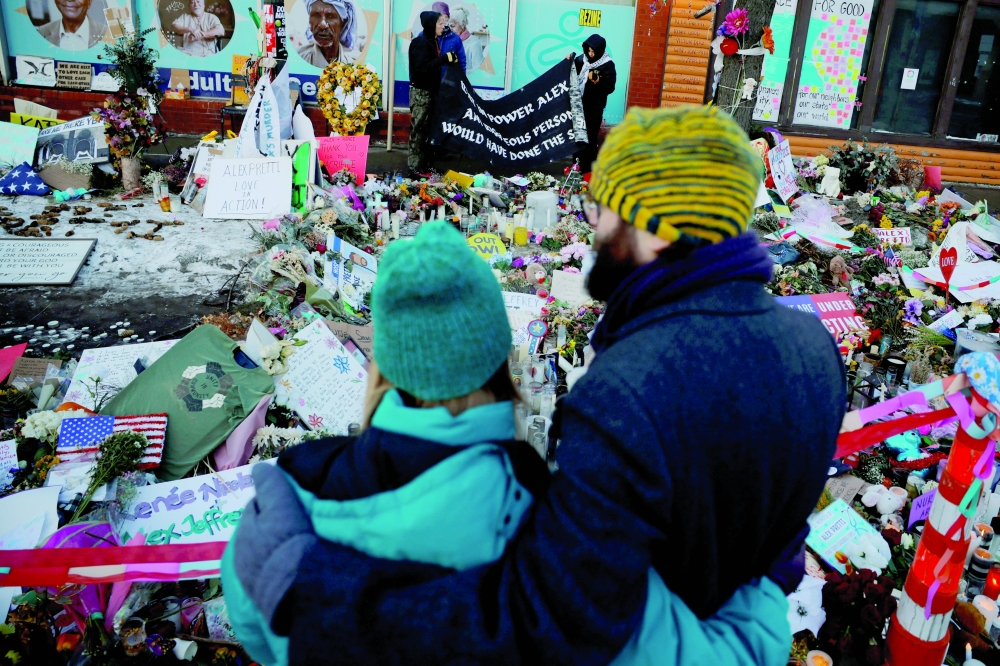 Community members gather at a memorial for Alex Pretti, after the fatal shootings of Renee Nicole Good and Pretti by federal immigration agents, in Minneapolis, Minnesota. — Reuters