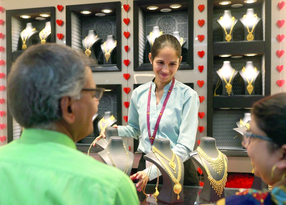 Gold was down seven per cent to $5,072 an ounce after reaching a record high of $5,595.47 on Thursday.