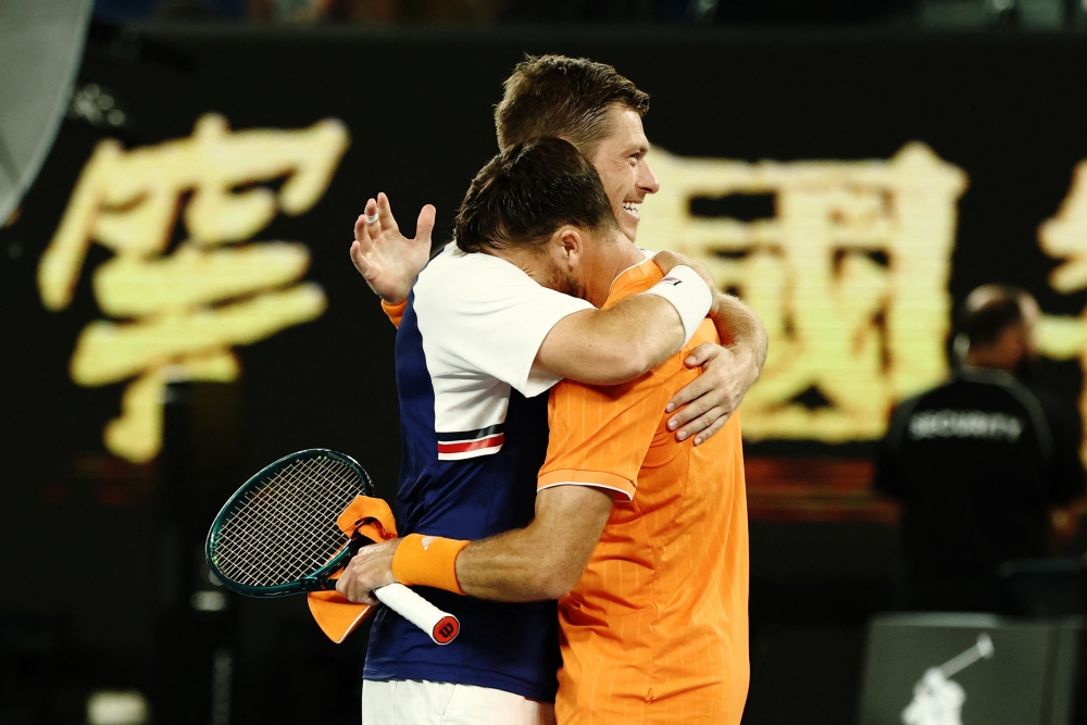  Christian Harrison of the U.S. and Britain's Neal Skupski hug 