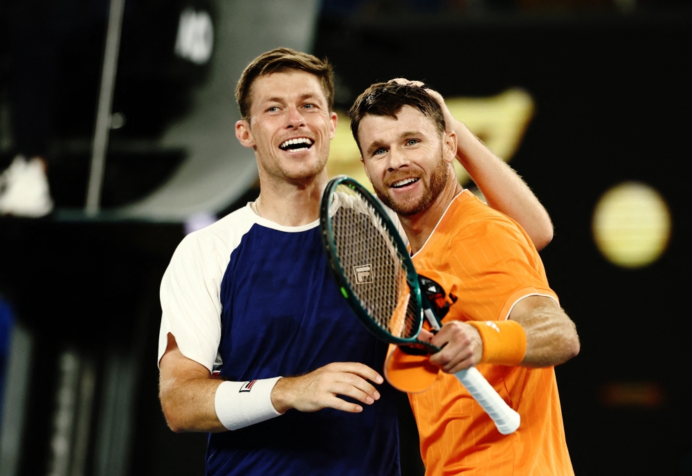 Christian Harrison of the U.S. and Britain's Neal Skupski celebrate after the winning 