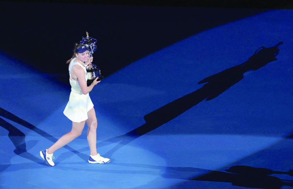 Elena Rybakina celebrates with the trophy after winning the women's singles final against Belarus' Aryna Sabalenka. — REUTERS