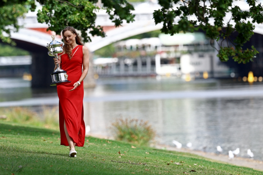 Kazakhstan's Elena Rybakina walks with the Australian Open trophy 