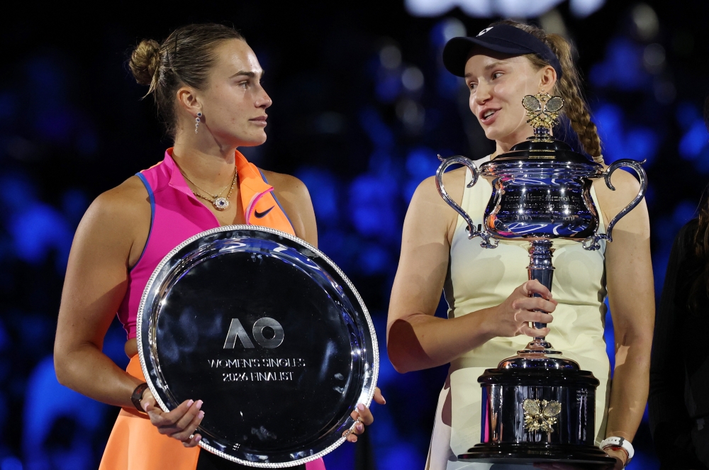 Kazakhstan's Elena Rybakina poses with the trophy alongside Belarus' Aryna Sabalenka 