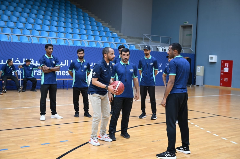 The instructor conducts a live match simulation, demonstrating foul judgement and movement techniques. — Khalfan al Ruzaiqi