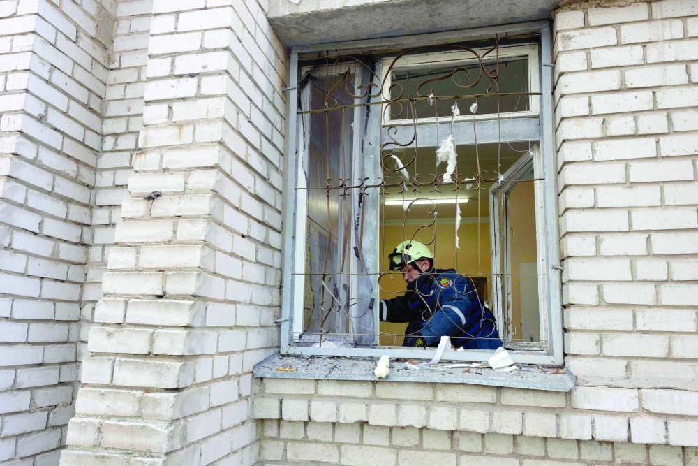A rescue worker clears debris in a damaged maternity hospital following a Russian strike in Zaporizhzhia amid the Russian attack on Ukraine. 
 — AFP