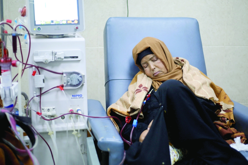 A Palestinian patient with kidney failure undergoes dialysis treatment at Al Aqsa Martyrs Hospital in Deir al Balah in the central Gaza Strip, on Sunday. — AFP