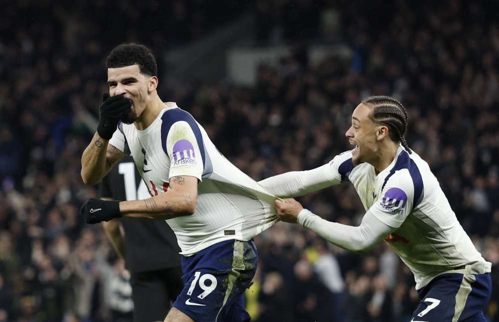   Tottenham Hotspur's Dominic Solanke celebrates scoring their second goal with Tottenham Hotspur's Xavi Simons 