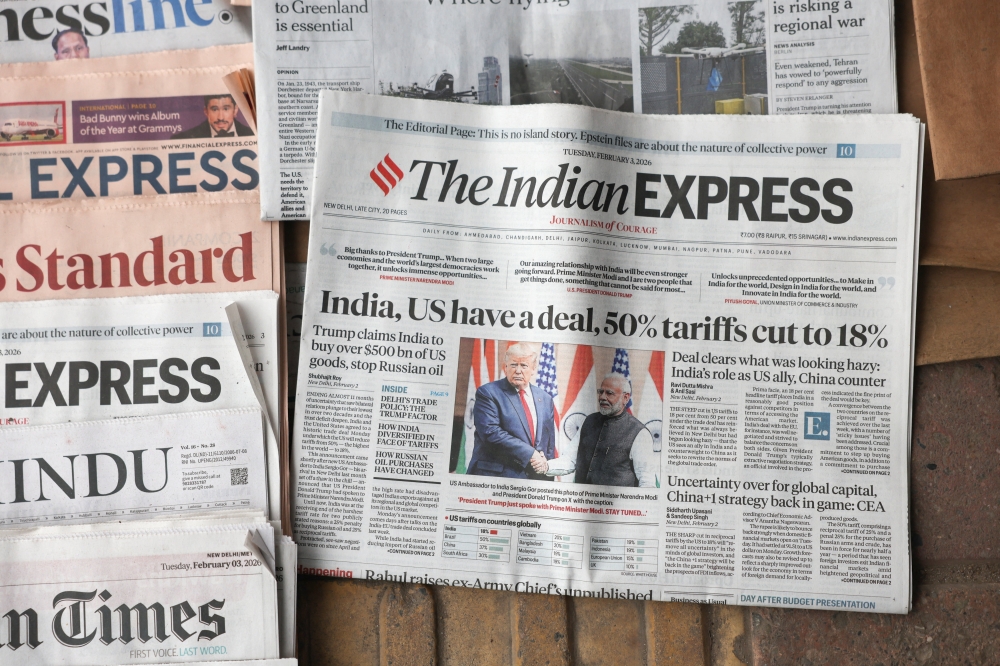 The latest edition of The Indian Express newspaper, with the lead story on U.S. tariffs on Indian imports slashed to 18%, is displayed for sale in New Delhi, India, February 3, 2026. REUTERS/Bhawika Chhabra