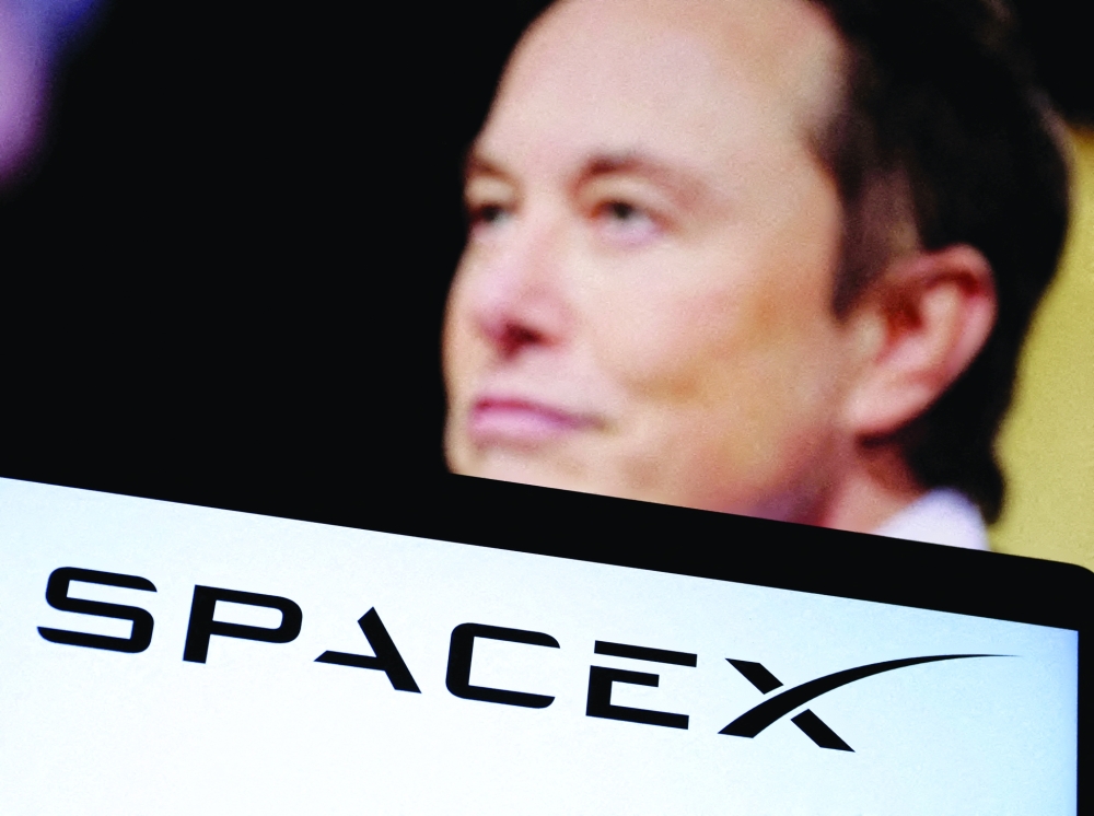 SpaceX's logo and an Elon Musk photo are seen in this illustration created. — Reuters