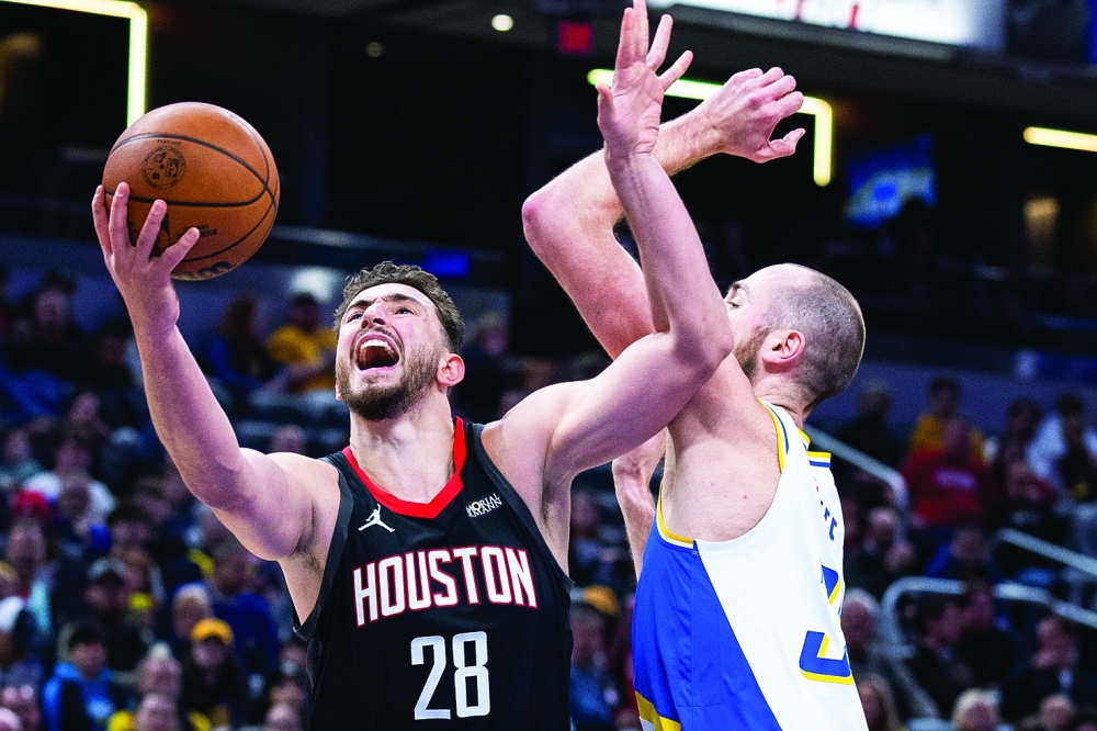 Houston Rockets' Alperen Sengun (28) shoots the ball while Indiana Pacers' Jay Huff (32) defends at Gainbridge Fieldhouse. — Imagn Images