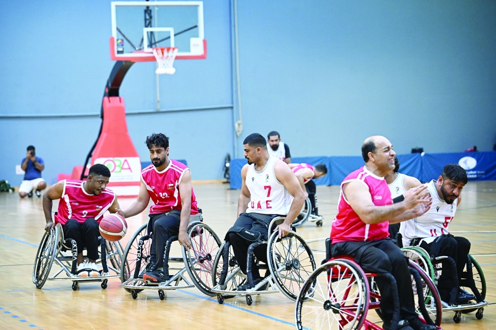 Oman and the UAE players in action during the wheelchair basketball game. — Saleh al Sharji  