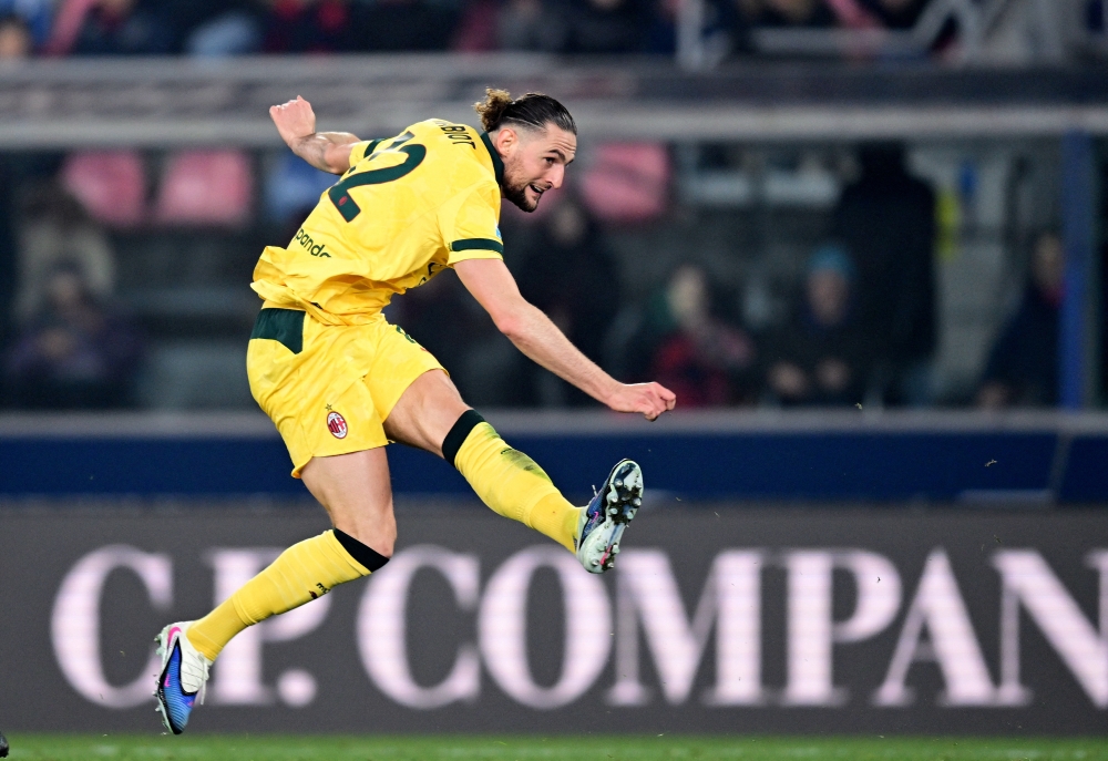  AC Milan's Adrien Rabiot scores their third goal 