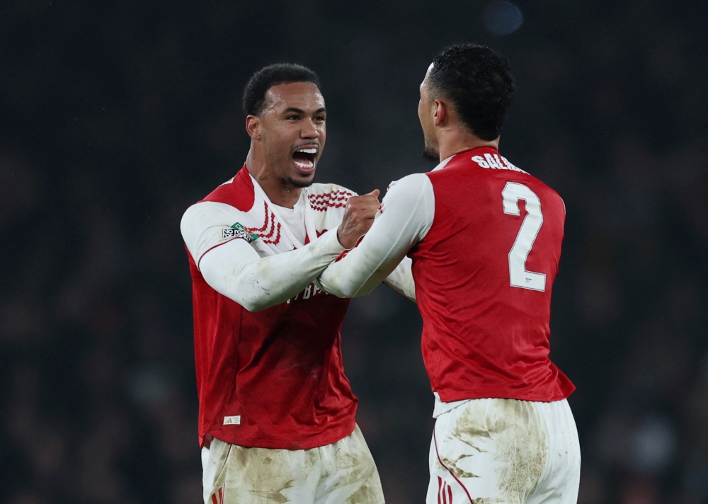  Arsenal's Gabriel Magalhaes celebrates after the match with William Saliba 