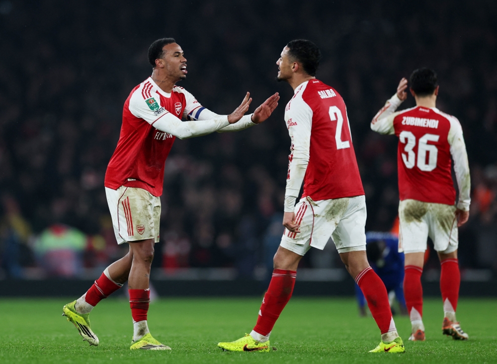  Arsenal's Gabriel Magalhaes celebrates after the match with William Saliba 