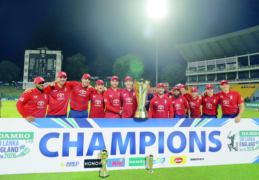 England players celebrate with the trophy after winning the series 