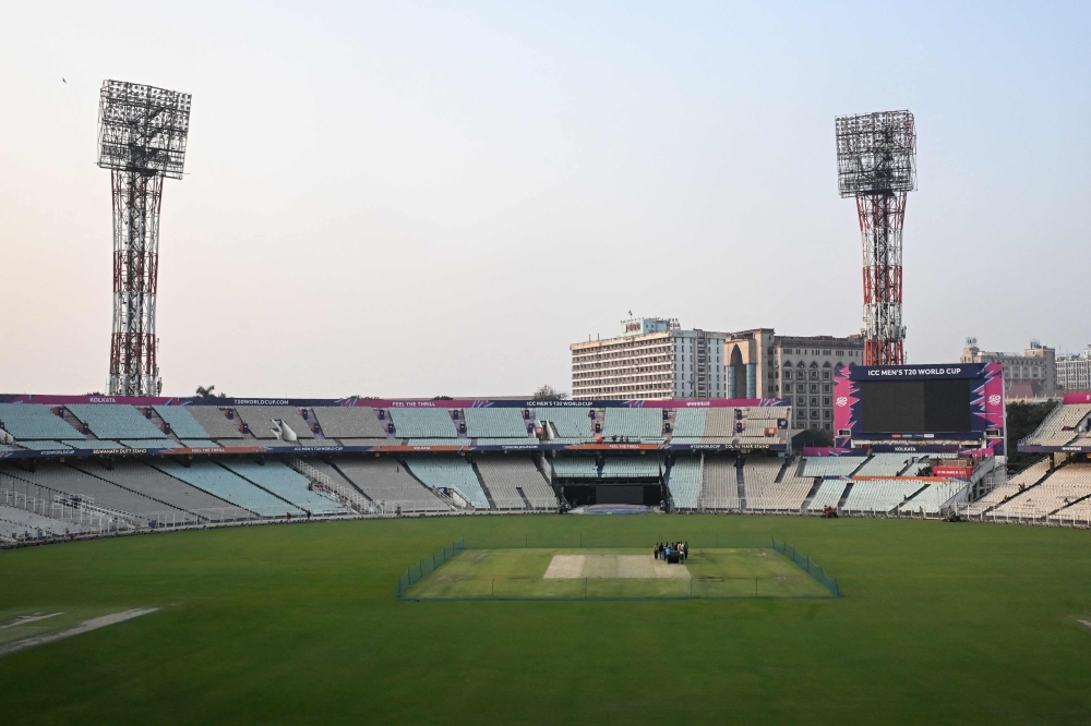 Groundsmen prepare the field at Eden Gardens stadium for the upcoming 2026 ICC Men's T20 Cricket World Cup in Kolkata 
