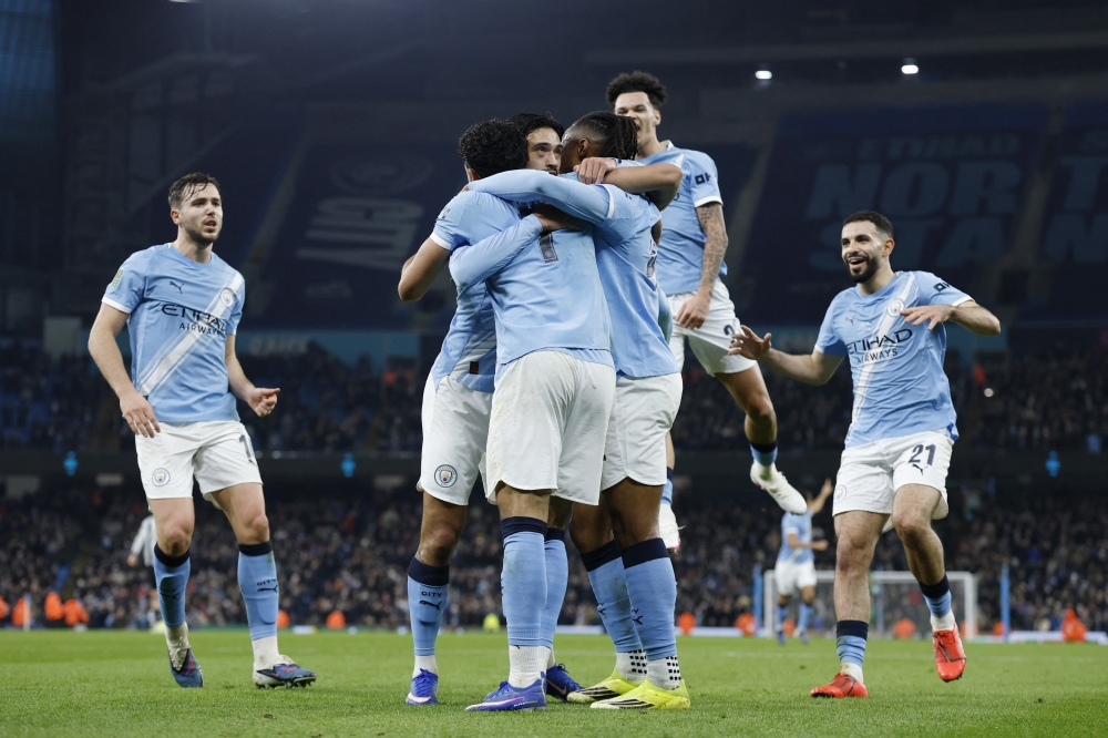  Manchester City's Omar Marmoush celebrates scoring their second goal with teammates  
