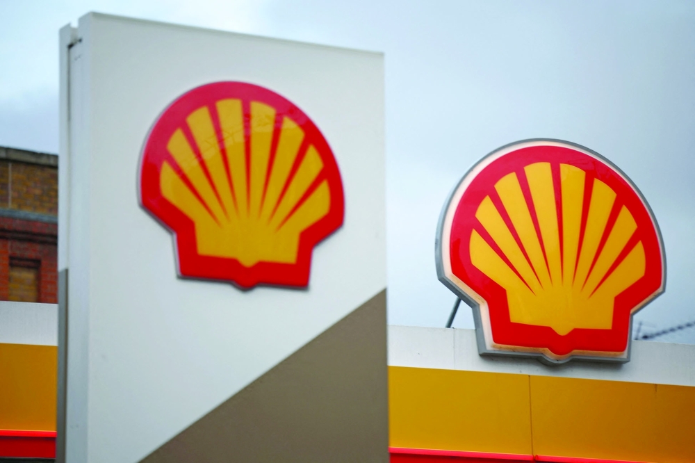 A Shell logo is pictured above a Shell petrol station in London on January 30, 2026. Shell is set to announce its full-year results on February 5. (Photo by HENRY NICHOLLS / AFP)