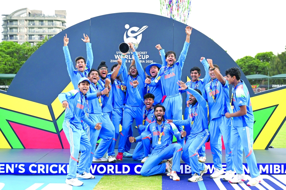 India players celebrate with the World Cup trophy.
