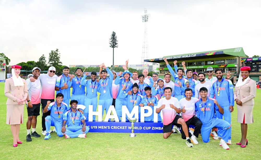 India players celebrate with the World Cup trophy.