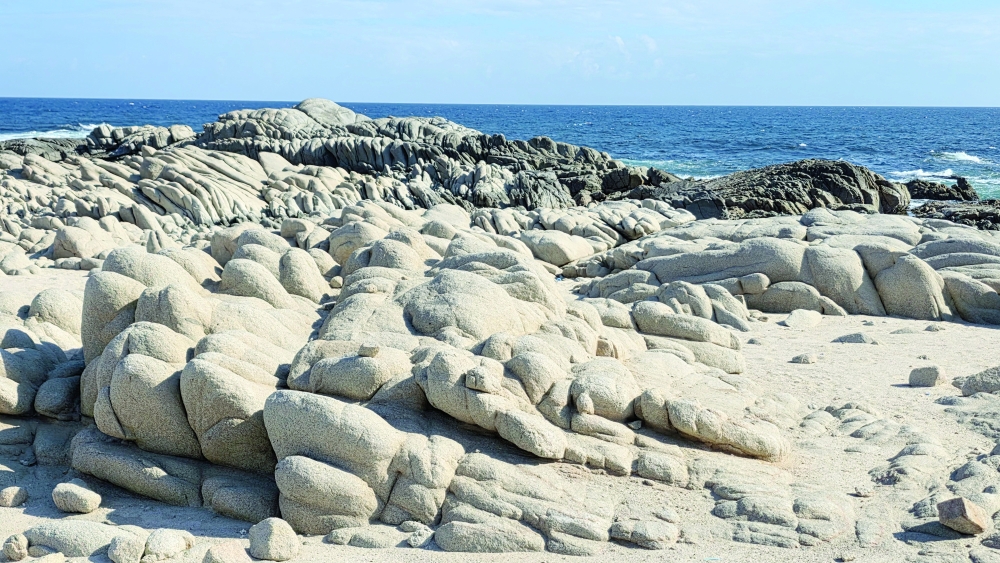 Rocky offshore shelves with waves breaking at Fazayah Beach