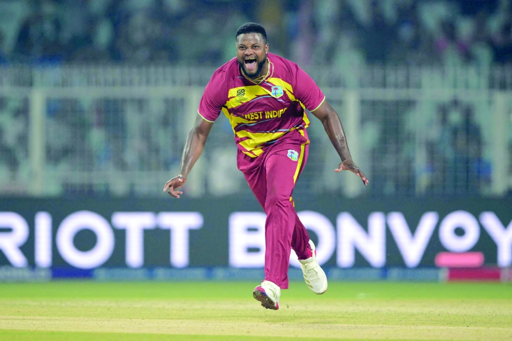 West Indies' Romario Shepherd celebrates after taking the hat trick wicket during the 2026 ICC Men's T20 Cricket World Cup group stage match between Scotland and West Indies. — AFP
