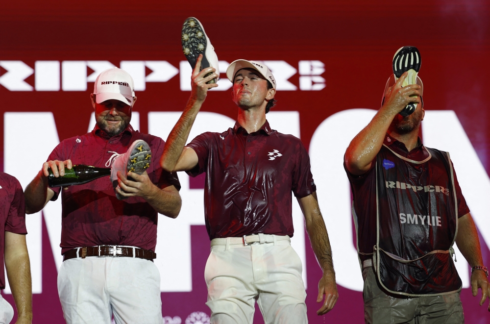   Ripper GC's Marc Leishman and Elvis Smylie celebrate after winning the final round  