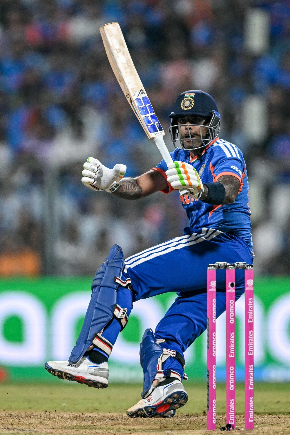 India's captain Suryakumar Yadav watches the ball after playing a shot  