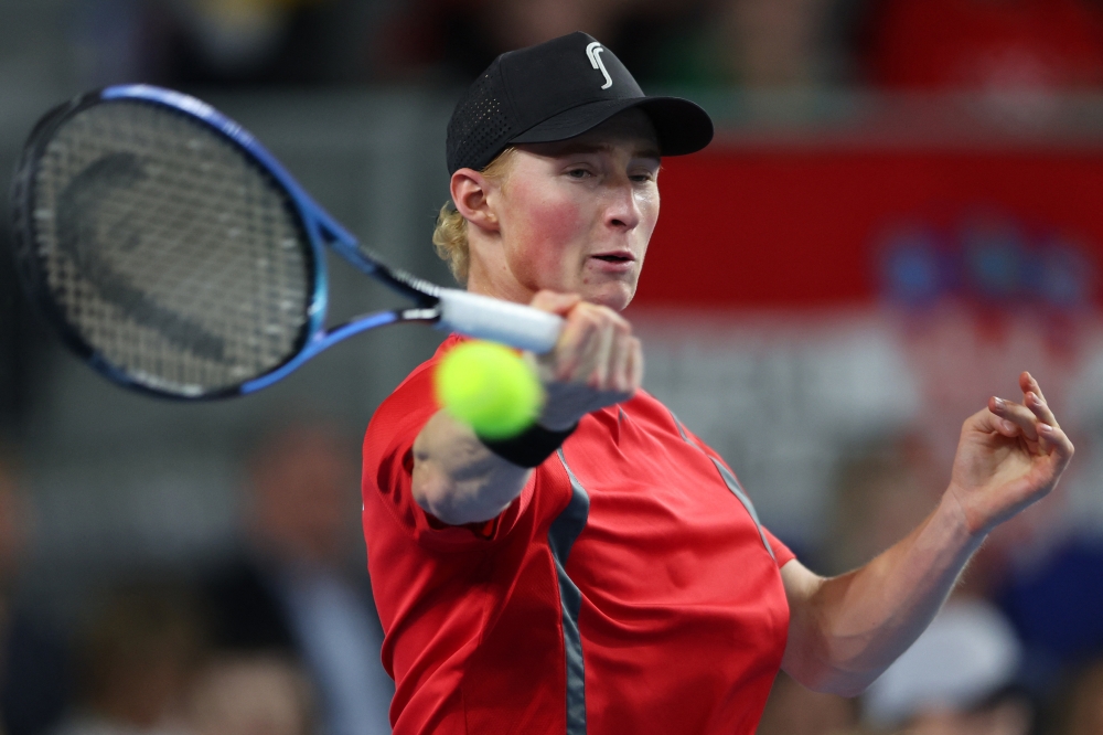   Denmark's Elmer Moller in action during his singles match against Croatia's Dino Prizmic  