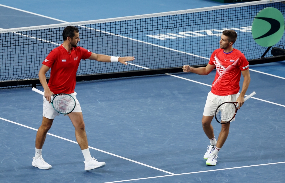Croatia's Nikola Mektic and Mate Pavic react during their doubles match against Denmark's Johannes Ingildsen and Carl Emil Overbeck  