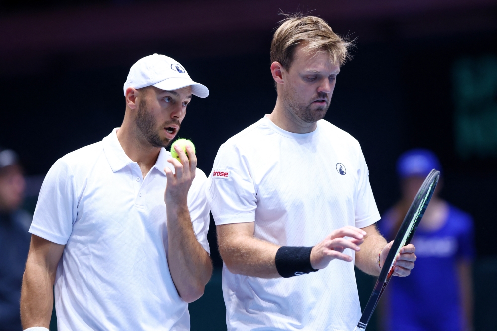  Germany's Kevin Krawietz and Tim Puetz react during their doubles match against Peru's Ignacio Buse and Arklon Huertas del Pino  