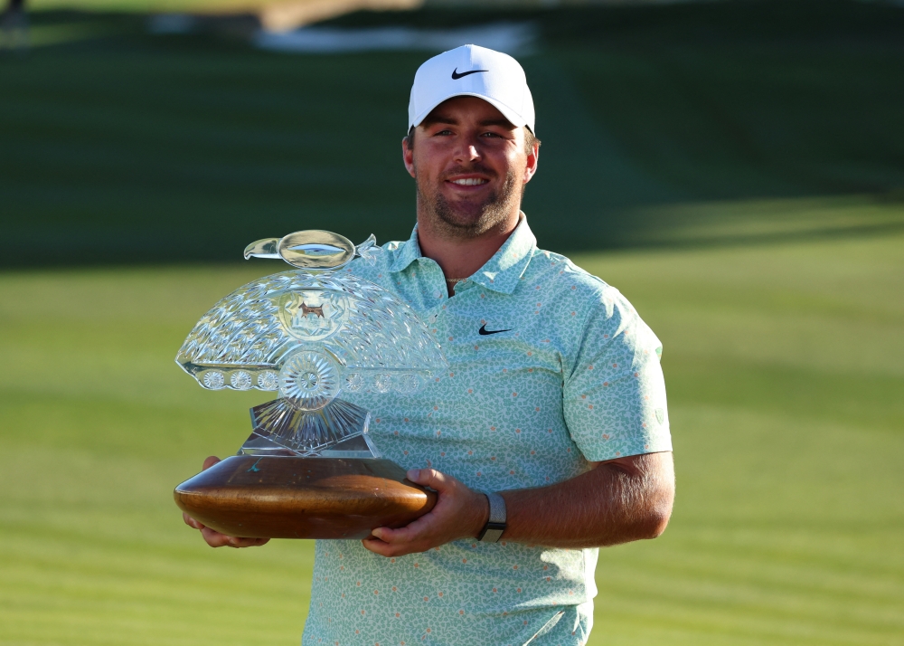  Chris Gotterup of the United States celebrates his win with the trophy after the final round of the WM Phoenix Open golf tournament. Mandatory Credit: Anna Carrington-Imagn Images