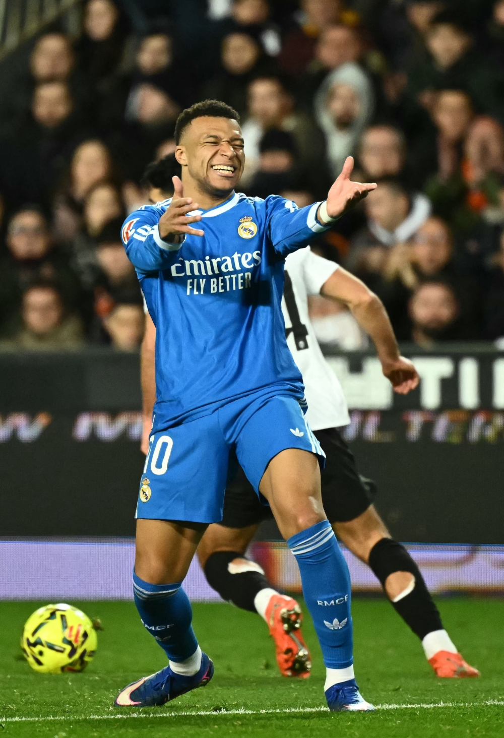 Real Madrid's French forward #10 Kylian Mbappe reacts  