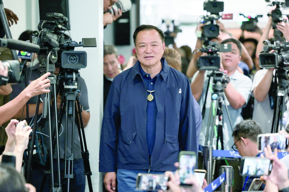 Thailand's caretaker PM Anutin Charnvirakul arrives for a press conference, in Bangkok. — Reuters
