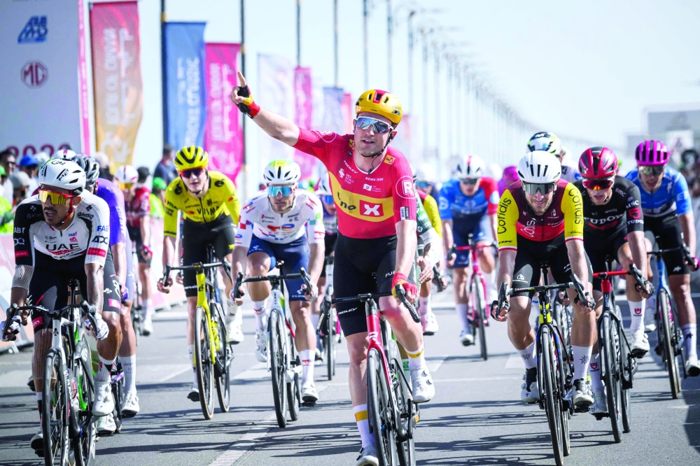 Uno-X Mobility Norvegian rider Erlend Blikra celebrates while crossing the finish line to win the 4th stage of the Tour of Oman cycling race from Al Sawadi to Sohar, on February 10, 2026. (Photo by Loic VENANCE / AFP)
