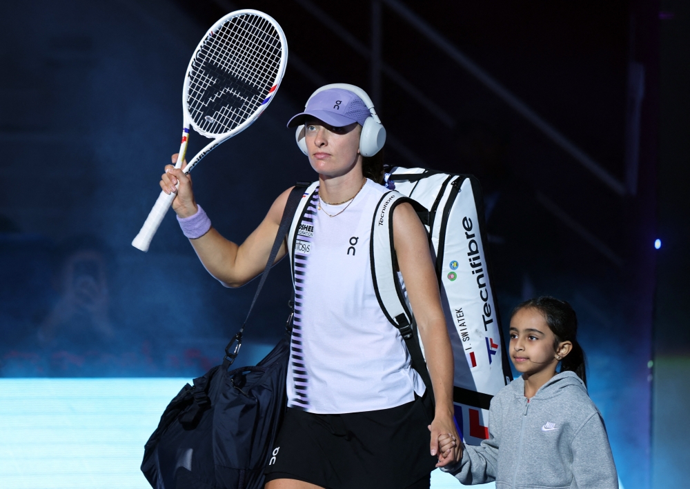   Poland's Iga Swiatek walks into the court for her round of 16 match against Australia's Daria Kasatkina  
