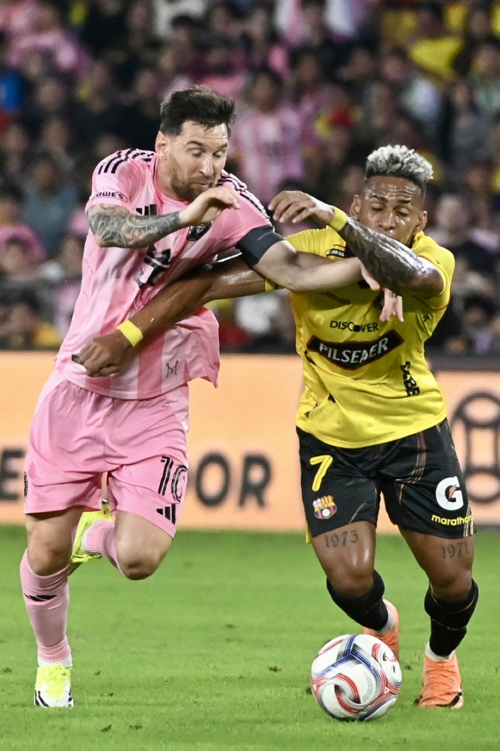 Inter Miami's Argentine forward #10 Lionel Messi AND Barcelona's defender #07 Jandry Gomez 