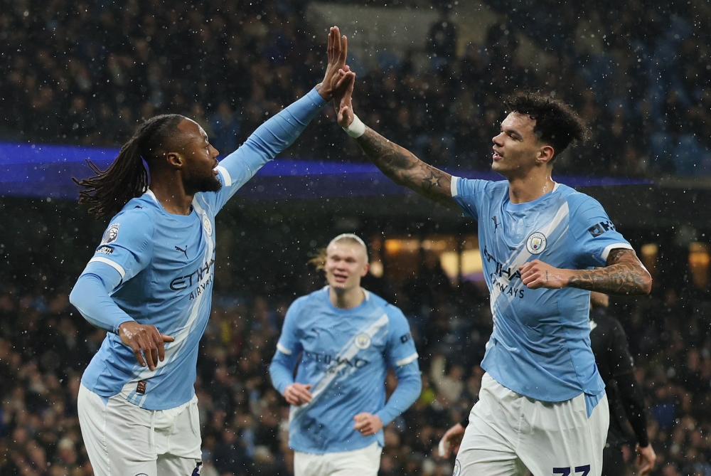  Manchester City's Antoine Semenyo celebrates scoring their first goal with Nico O'Reilly  