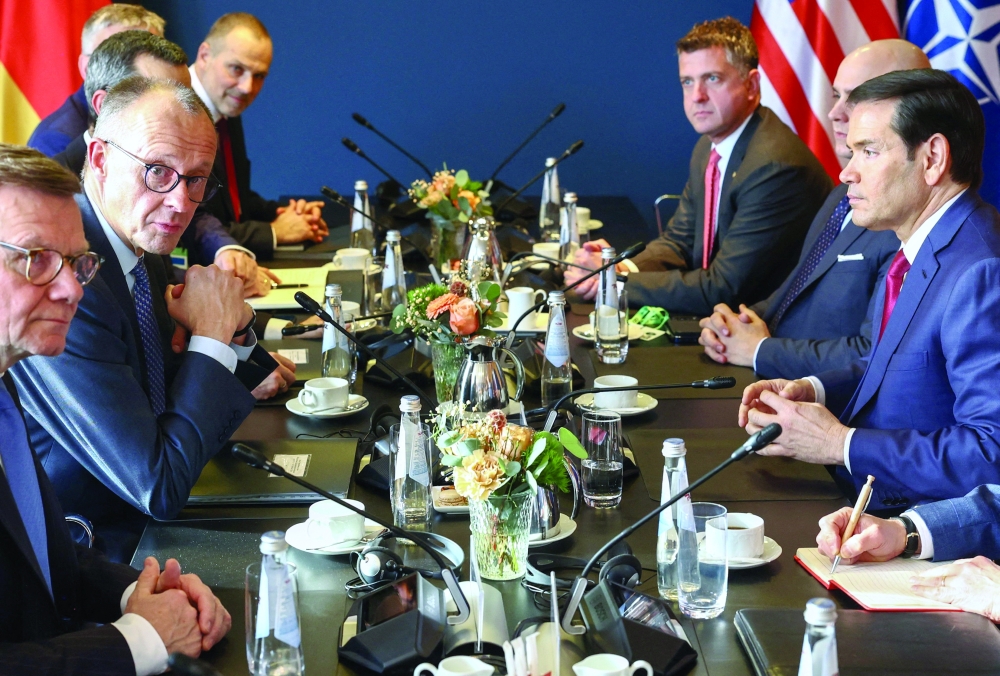 German Chancellor Friedrich Merz (2nd L), German Foreign Minister Johann Wadephul and US Secretary of State Marco Rubio on the sidelines of the Munich Security Conference (MSC) in Munich