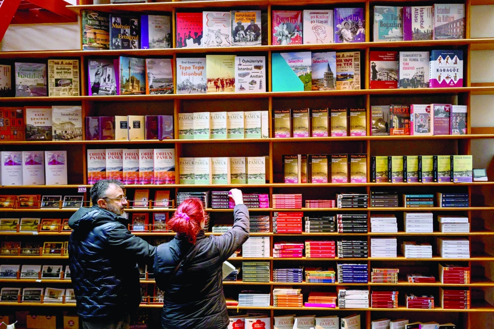 Visitors look at the library in The Museum of Innocence in Istanbul.